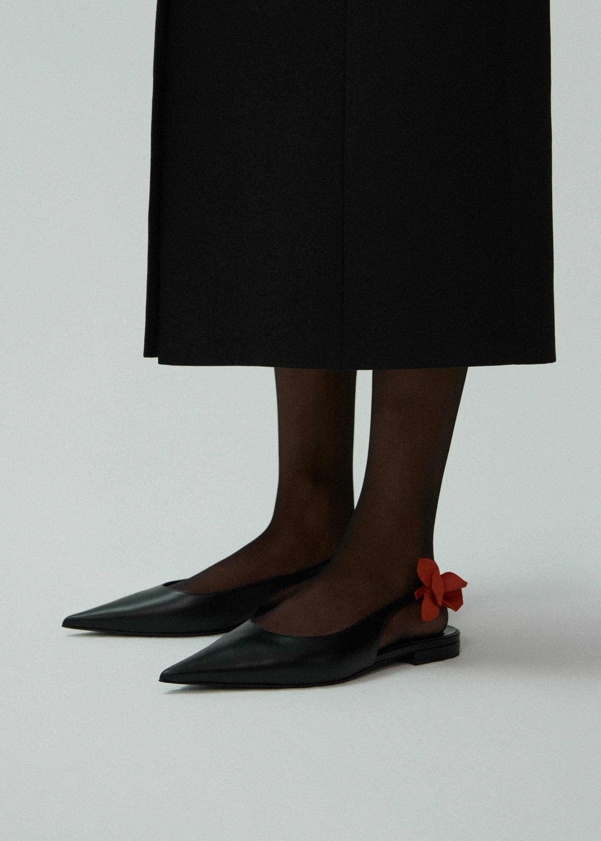 Slingback rose flats in black leather