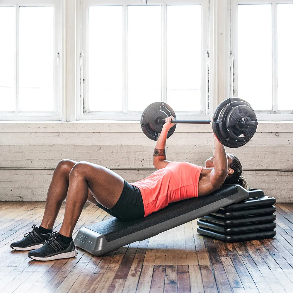 The Step Deluxe Adjustable Weight Barbell Set (includes the bar)